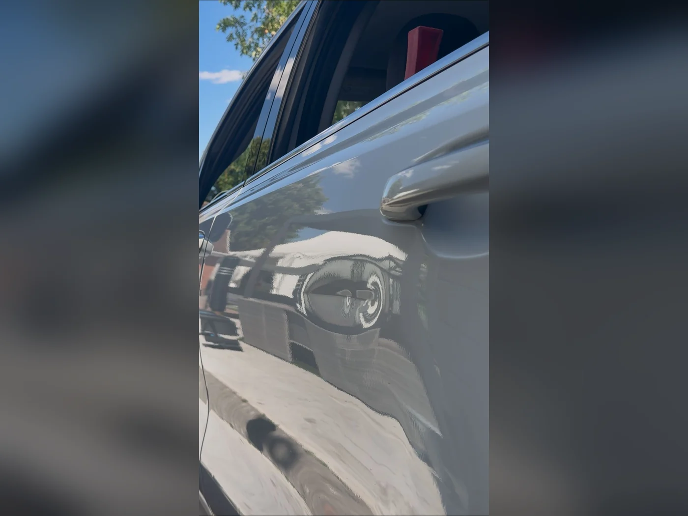 Before — creased door panel on a silver car in Luton